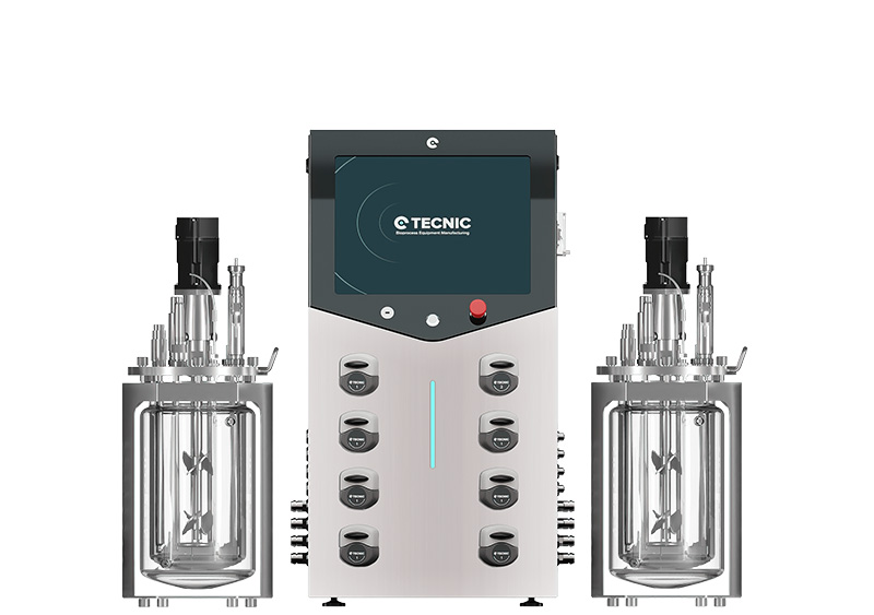 Image of eLAB Advanced Bioreactor, bioprocess technology by TECNIC, flanked by two stainless steel vessels