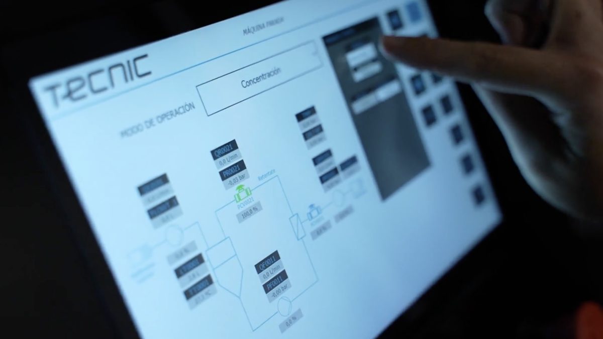 A person operating a bioreactor is moving through the eSCADA software by TECNIC.